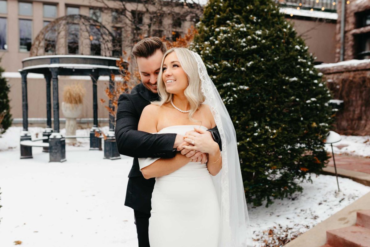 Bride and groom outside the mansion