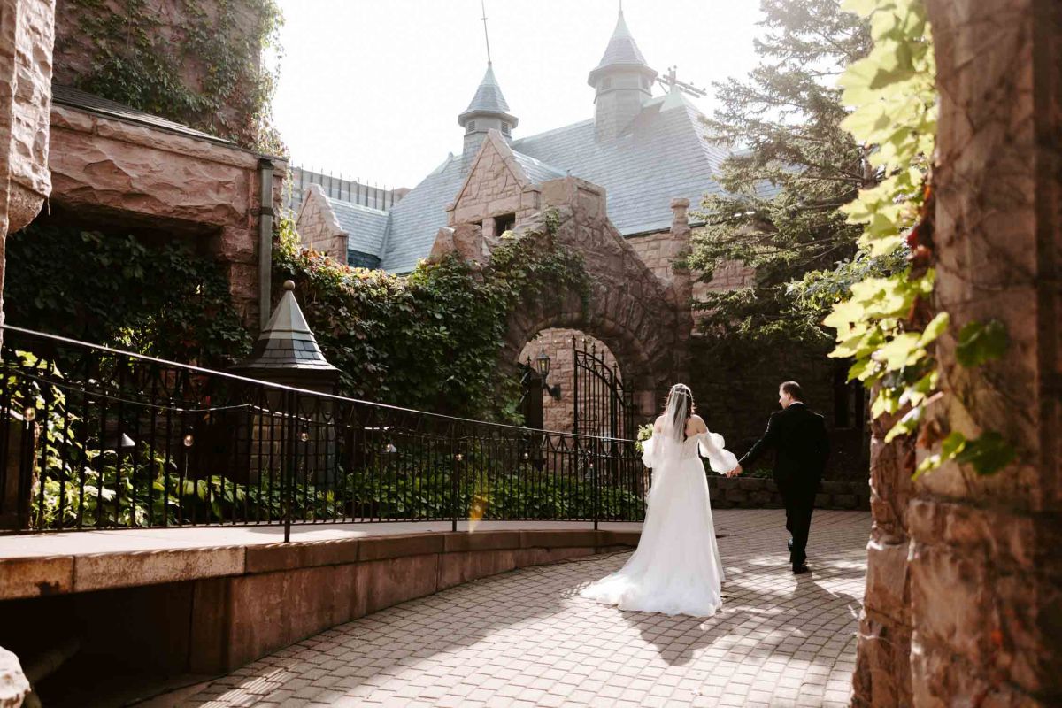 Bride and groom outside the mansion