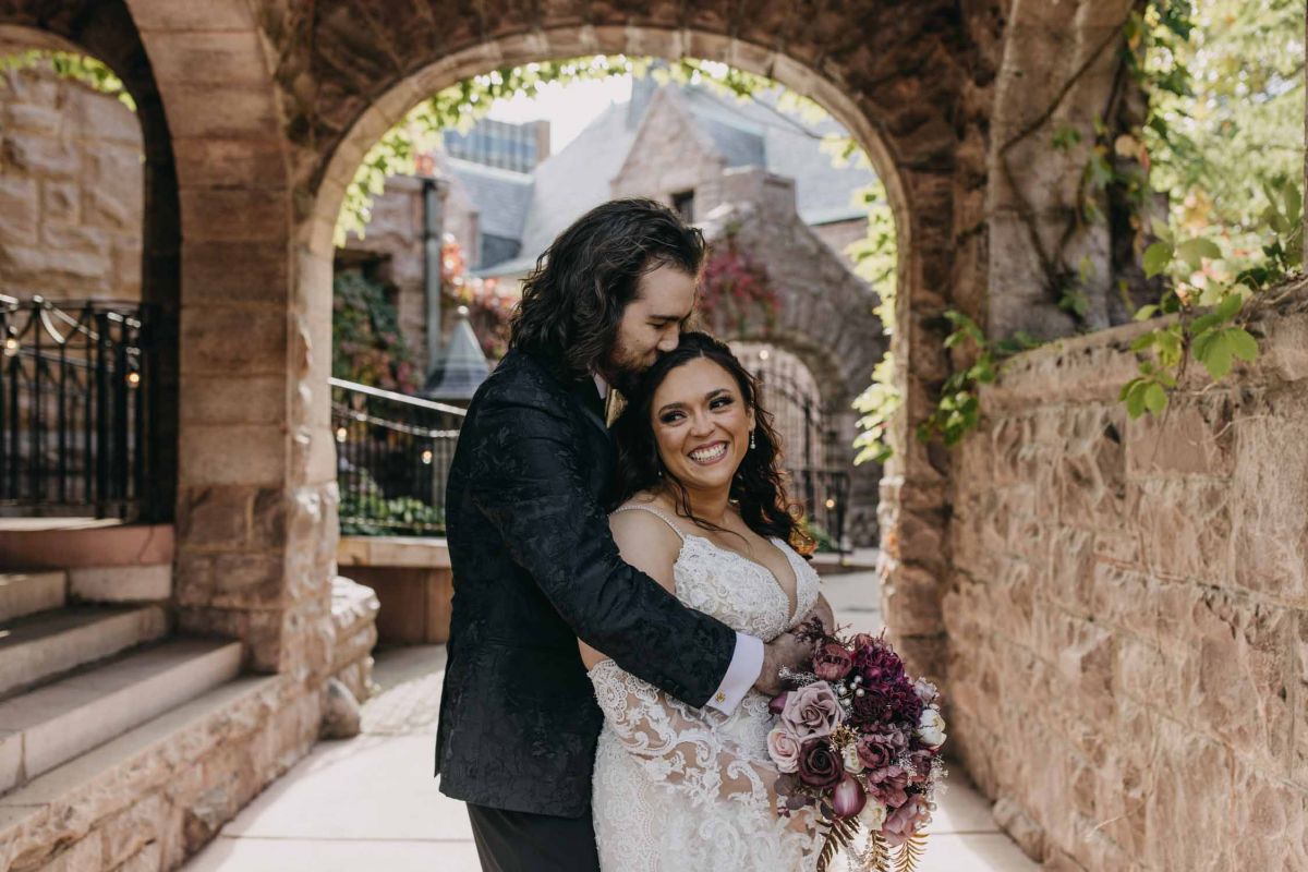 Bride and groom outside the mansion