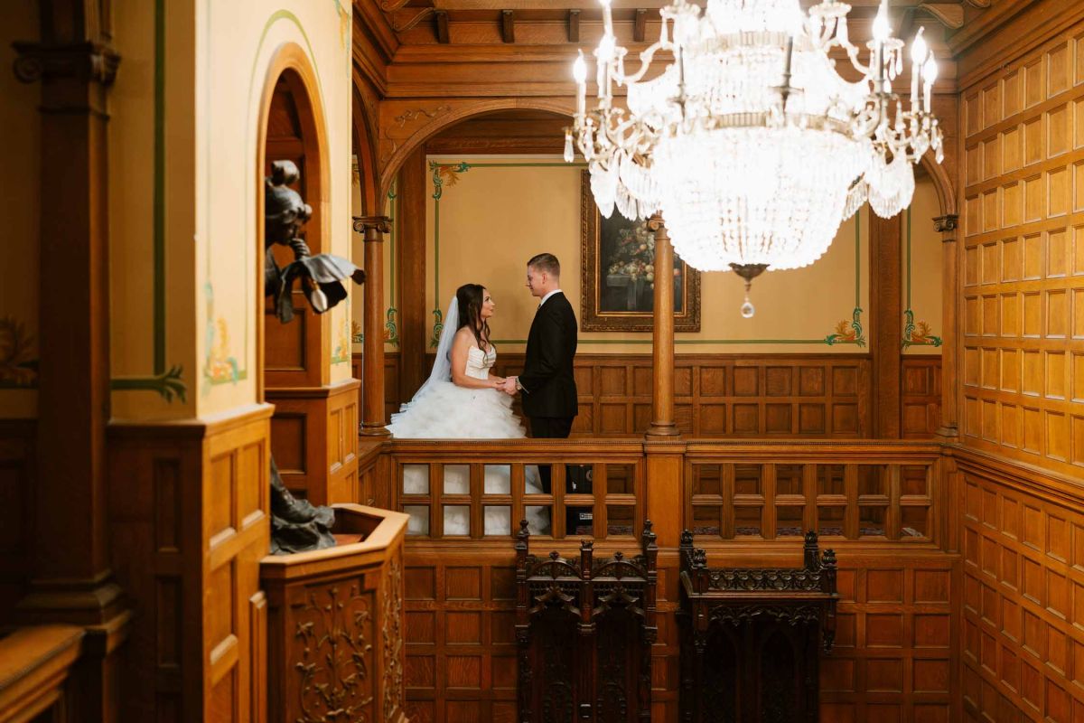 Bride and groom outside the mansion